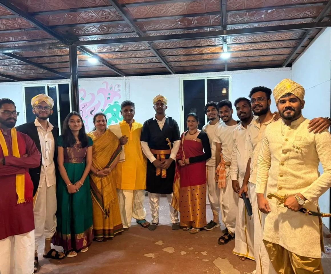 Our team at Mobil80's Christmas game night, dressed in traditional Karnataka clothes, with yellow Mysore peta turbans, silk sarees and dhotis.